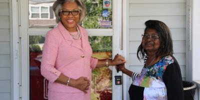 Congresswoman Beatty stands with a new homeowner.